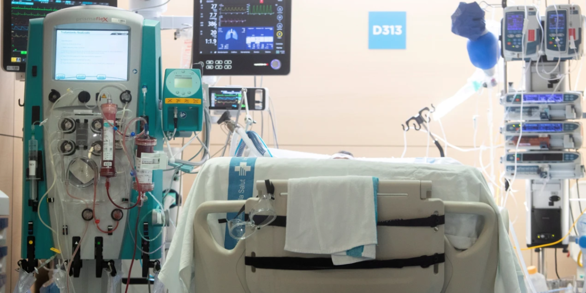 Hospital Intensive Care Bed Connected to Monitors, Iv Lines, and Life-support Machinery in a Bright Icu. - Tu Colonia Regia